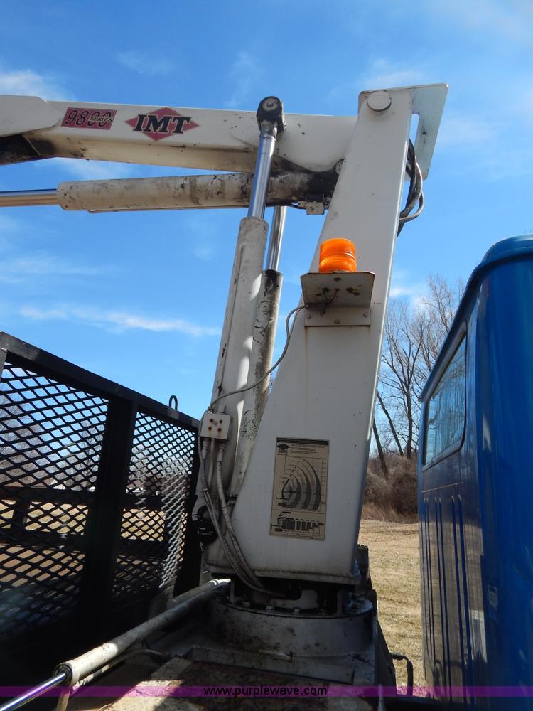 image for item I1134 1996 International 4900 flatbed truck with crane