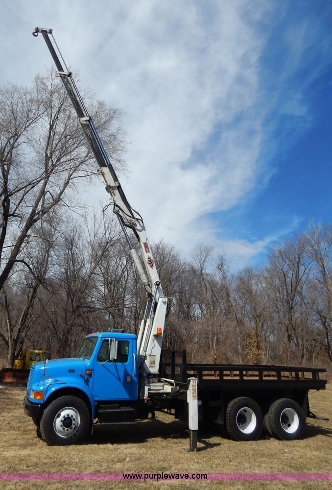 image for item I1134 1996 International 4900 flatbed truck with crane