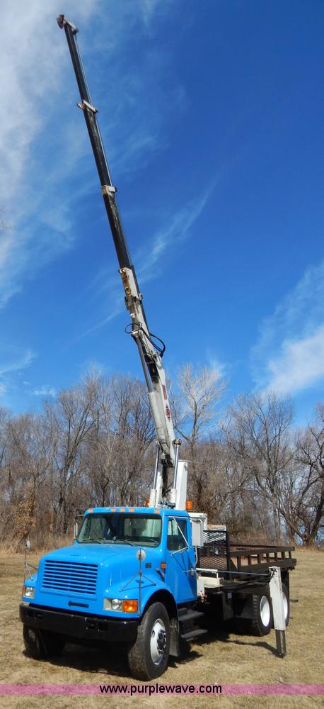image for item I1134 1996 International 4900 flatbed truck with crane