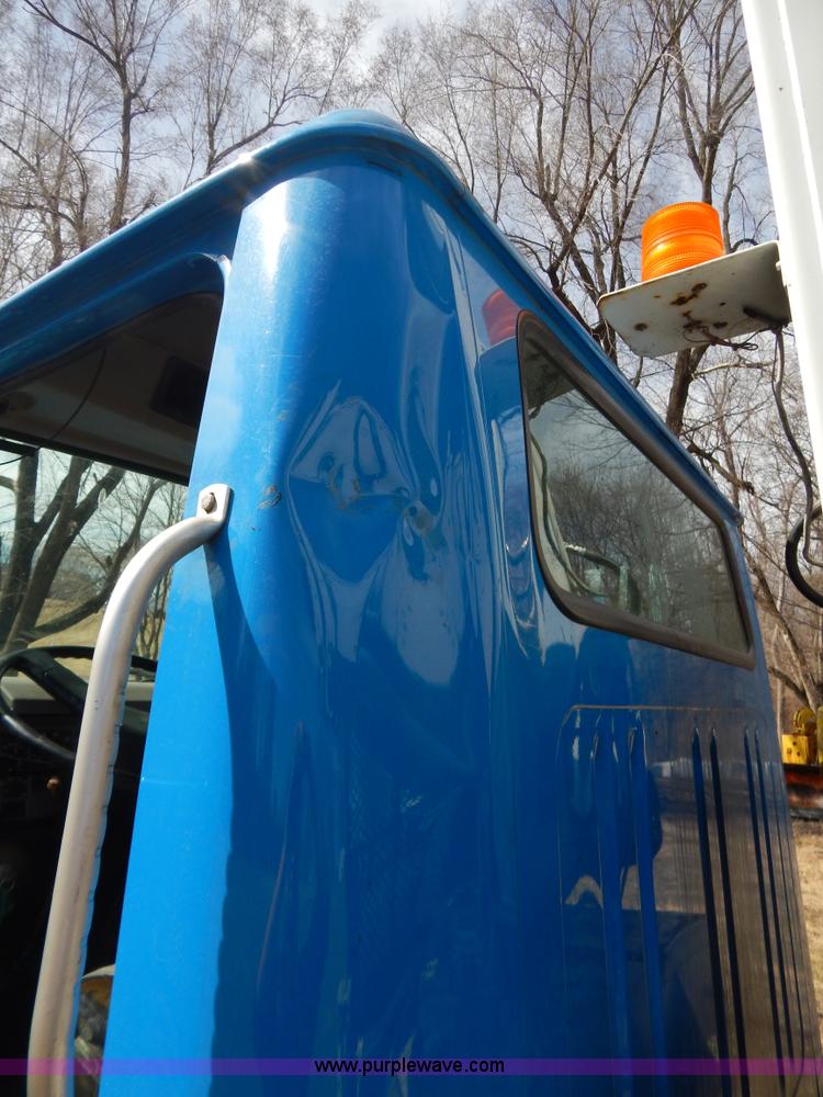 image for item I1134 1996 International 4900 flatbed truck with crane