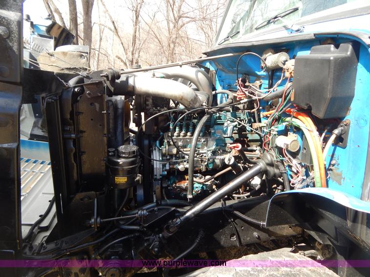 image for item I1134 1996 International 4900 flatbed truck with crane