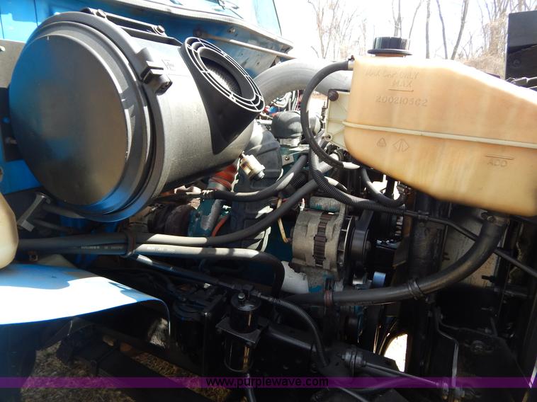 image for item I1134 1996 International 4900 flatbed truck with crane