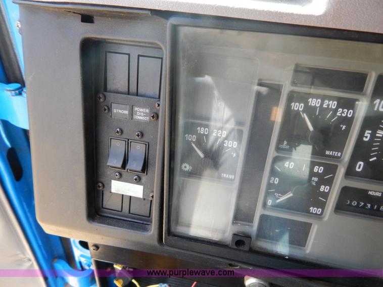 image for item I1134 1996 International 4900 flatbed truck with crane