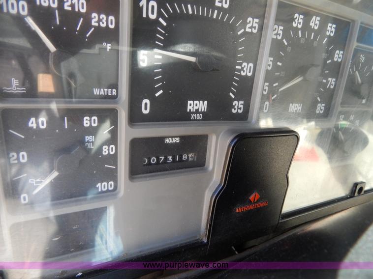 image for item I1134 1996 International 4900 flatbed truck with crane