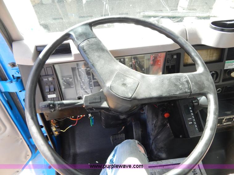 image for item I1134 1996 International 4900 flatbed truck with crane