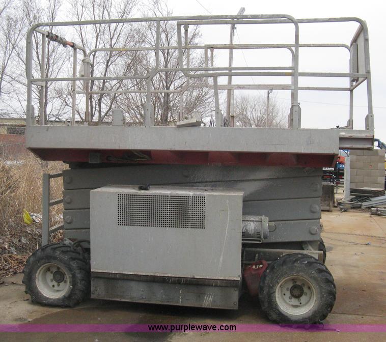 image for item I5637 1999 Mec 30724WD rough terrain scissor lift