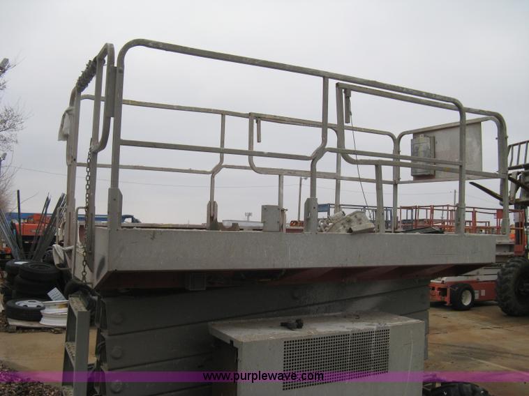 image for item I5637 1999 Mec 30724WD rough terrain scissor lift