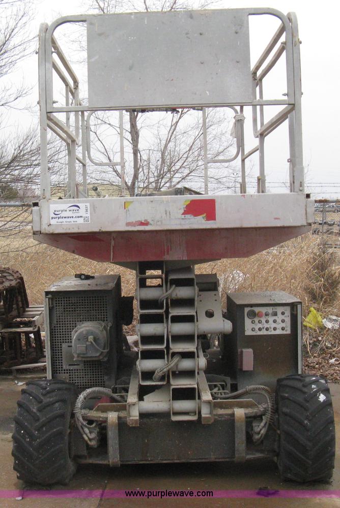 image for item I5637 1999 Mec 30724WD rough terrain scissor lift