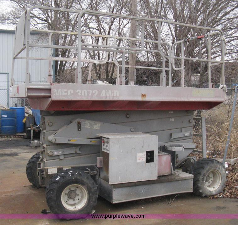 image for item I5637 1999 Mec 30724WD rough terrain scissor lift