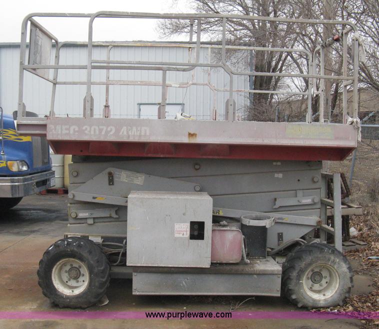 image for item I5637 1999 Mec 30724WD rough terrain scissor lift