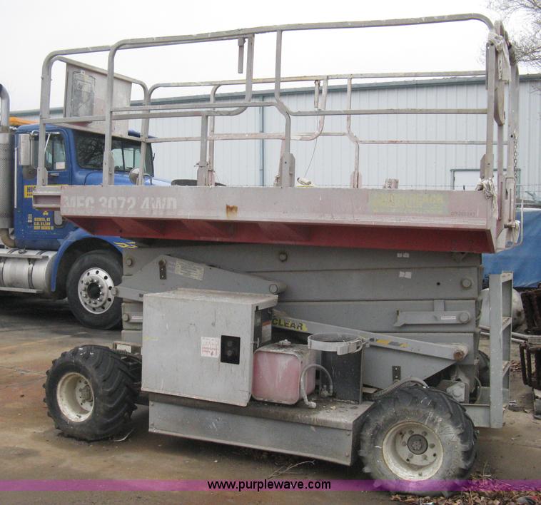 image for item I5637 1999 Mec 30724WD rough terrain scissor lift