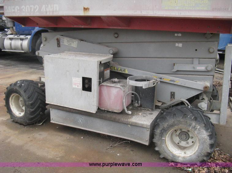 image for item I5637 1999 Mec 30724WD rough terrain scissor lift