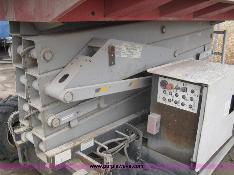 image for item I5637 1999 Mec 30724WD rough terrain scissor lift