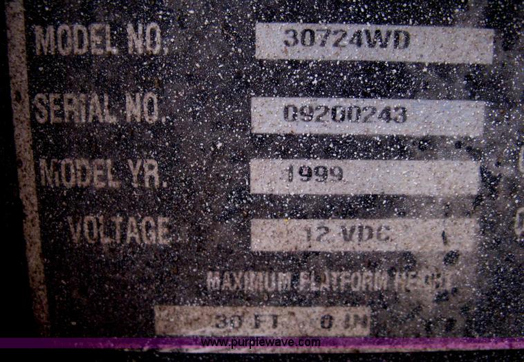 image for item I5637 1999 Mec 30724WD rough terrain scissor lift