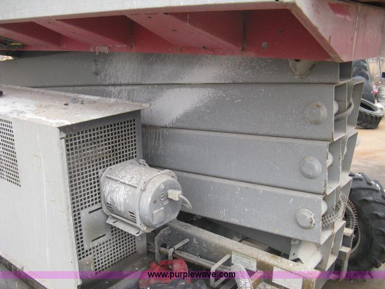 image for item I5637 1999 Mec 30724WD rough terrain scissor lift