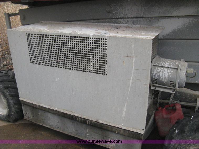 image for item I5637 1999 Mec 30724WD rough terrain scissor lift