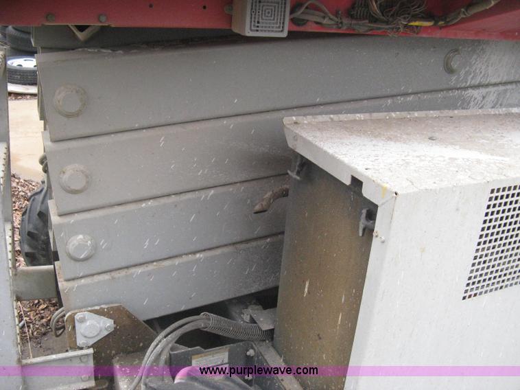 image for item I5637 1999 Mec 30724WD rough terrain scissor lift