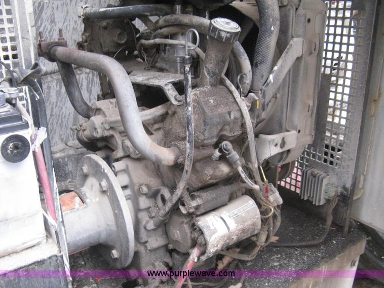 image for item I5637 1999 Mec 30724WD rough terrain scissor lift