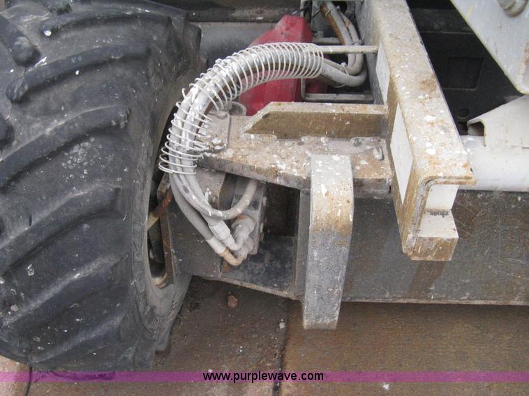 image for item I5637 1999 Mec 30724WD rough terrain scissor lift