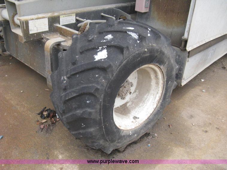 image for item I5637 1999 Mec 30724WD rough terrain scissor lift