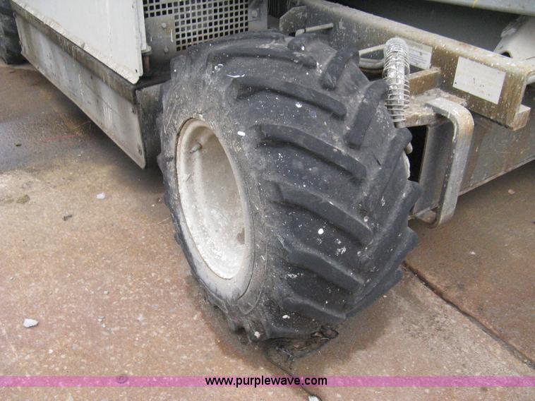 image for item I5637 1999 Mec 30724WD rough terrain scissor lift