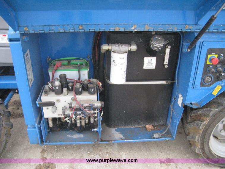 image for item I5638 2002 Genie GS3268RT scissor lift