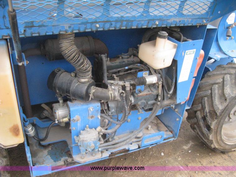 image for item I5638 2002 Genie GS3268RT scissor lift