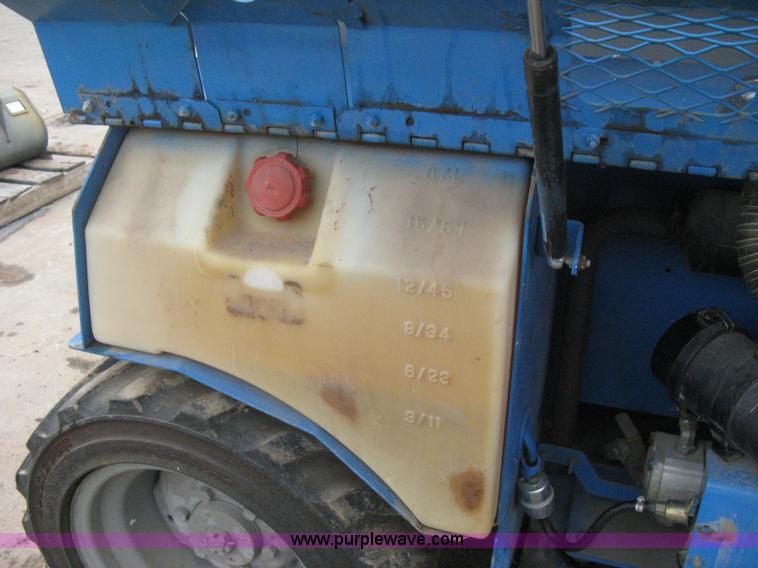 image for item I5638 2002 Genie GS3268RT scissor lift