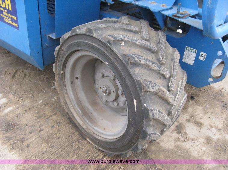 image for item I5638 2002 Genie GS3268RT scissor lift