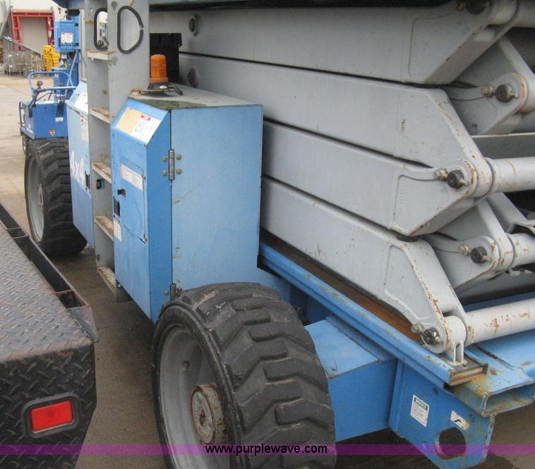 image for item I5652 2004 Genie GS-4390 rough terrain scissor lift