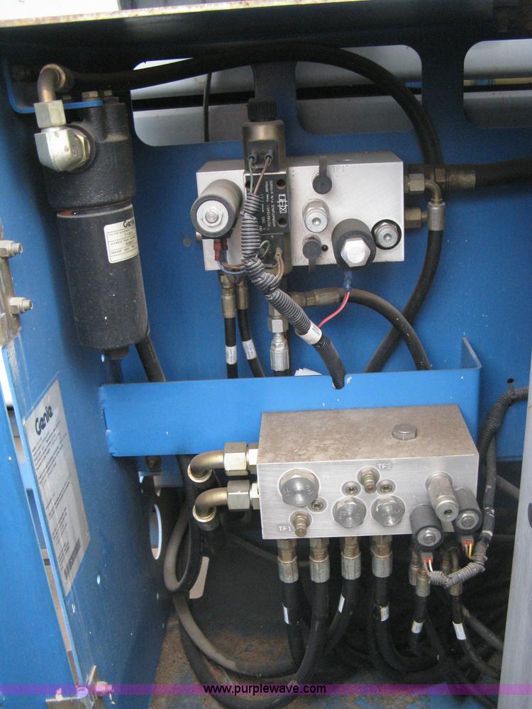 image for item I5652 2004 Genie GS-4390 rough terrain scissor lift