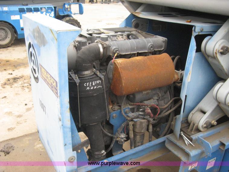 image for item I5652 2004 Genie GS-4390 rough terrain scissor lift