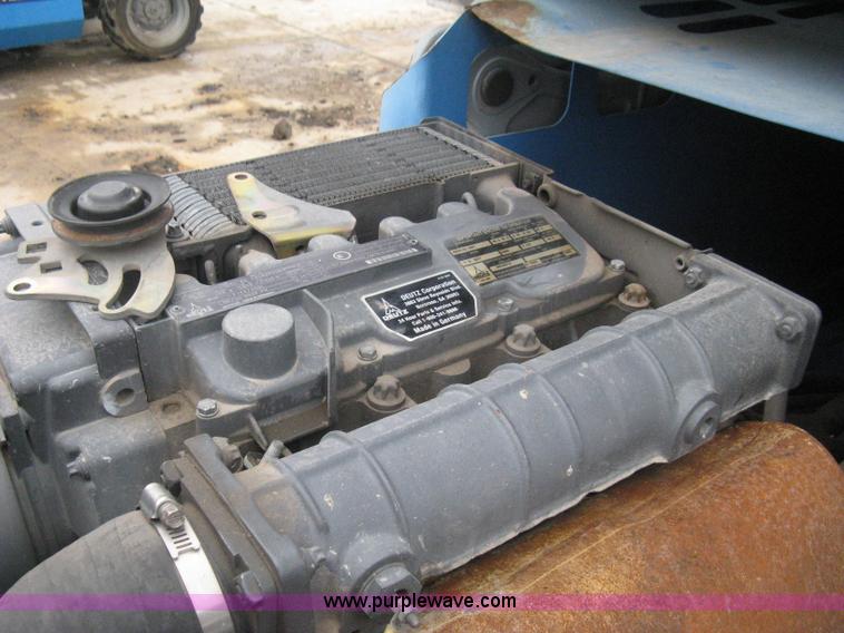 image for item I5652 2004 Genie GS-4390 rough terrain scissor lift