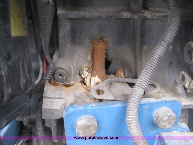 image for item I5652 2004 Genie GS-4390 rough terrain scissor lift