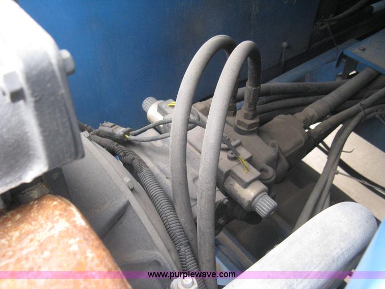 image for item I5652 2004 Genie GS-4390 rough terrain scissor lift