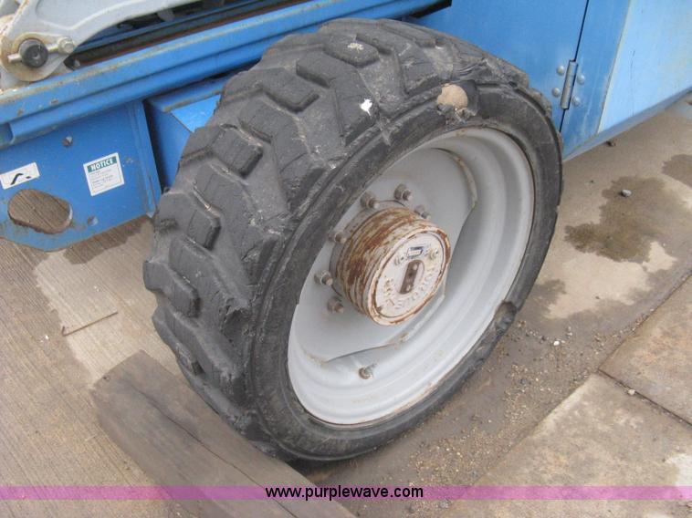 image for item I5652 2004 Genie GS-4390 rough terrain scissor lift