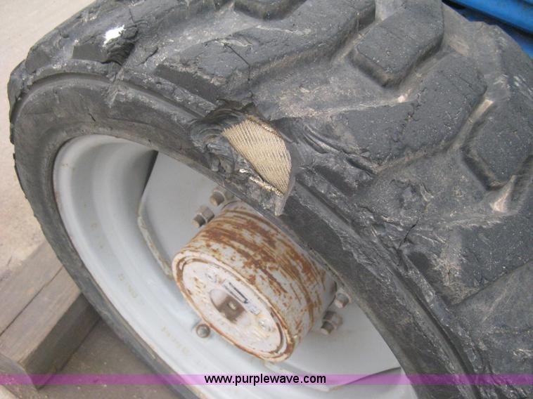 image for item I5652 2004 Genie GS-4390 rough terrain scissor lift