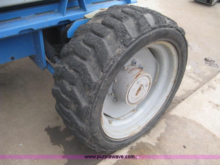 image for item I5652 2004 Genie GS-4390 rough terrain scissor lift