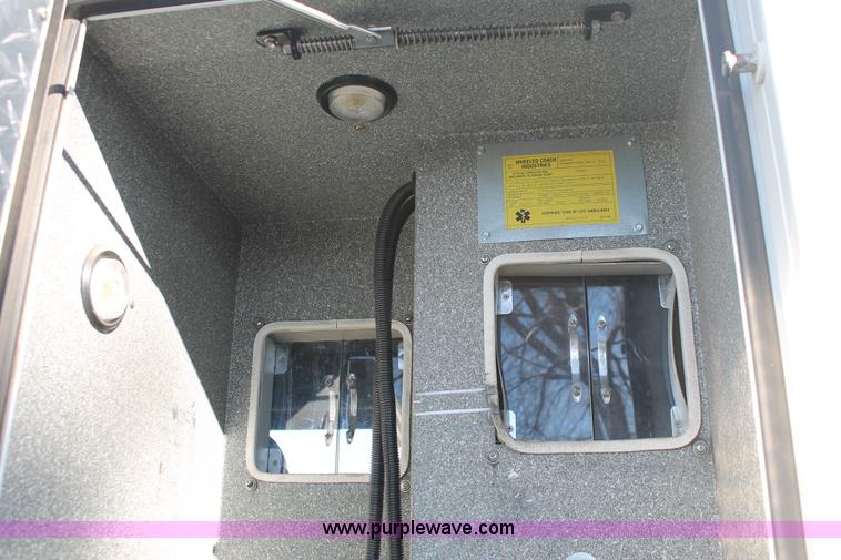 image for item H8289 2000 Freightliner FL60 ambulance