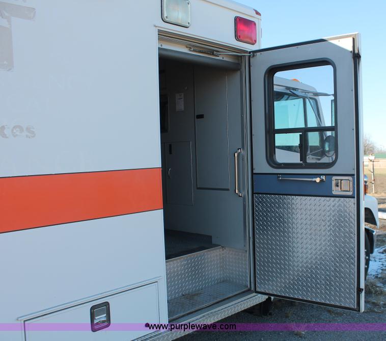 image for item H8289 2000 Freightliner FL60 ambulance