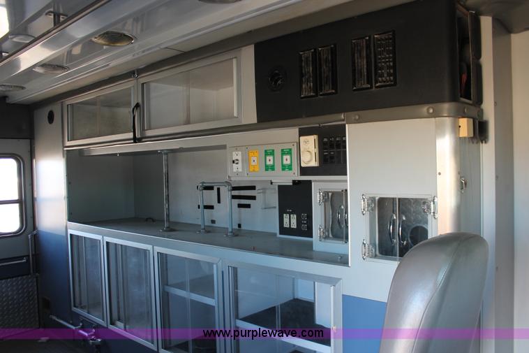 image for item H8289 2000 Freightliner FL60 ambulance