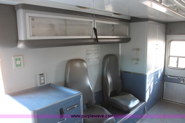 image for item H8289 2000 Freightliner FL60 ambulance