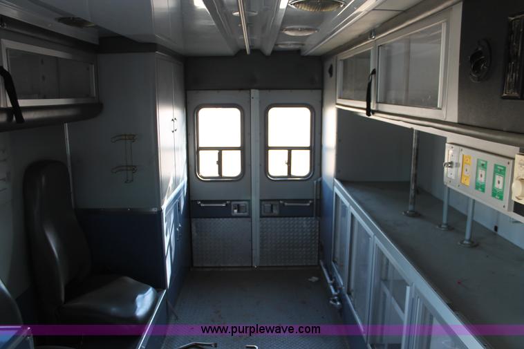 image for item H8289 2000 Freightliner FL60 ambulance