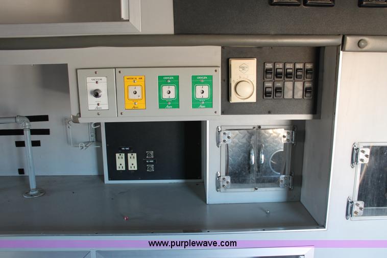 image for item H8289 2000 Freightliner FL60 ambulance