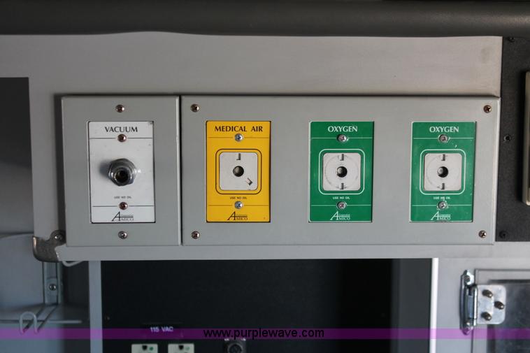 image for item H8289 2000 Freightliner FL60 ambulance