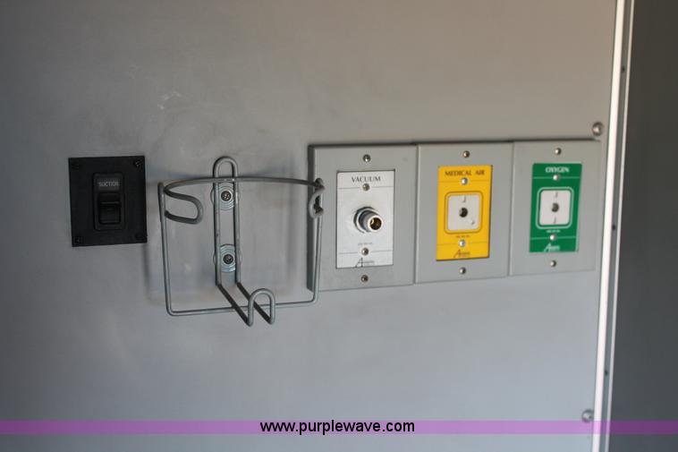 image for item H8289 2000 Freightliner FL60 ambulance