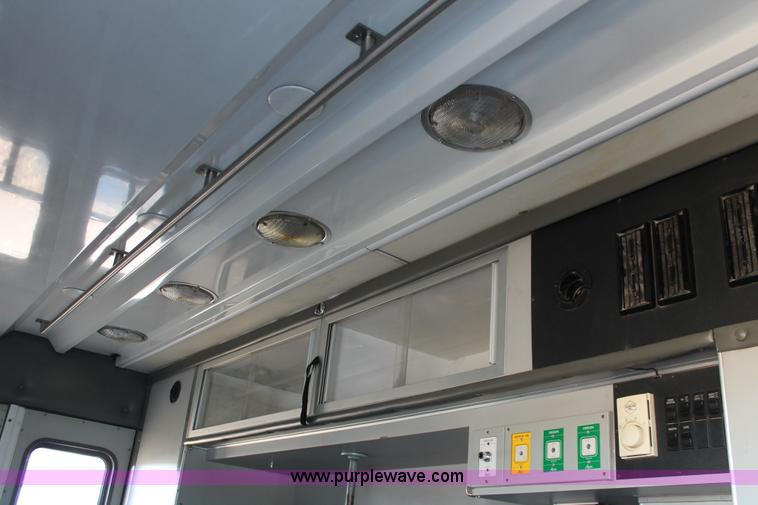 image for item H8289 2000 Freightliner FL60 ambulance