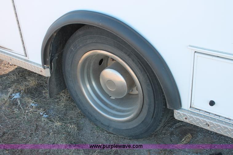 image for item H8289 2000 Freightliner FL60 ambulance