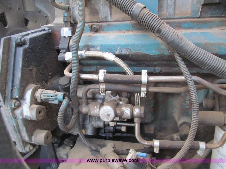 image for item I7160 1996 International 4700 flatbed truck