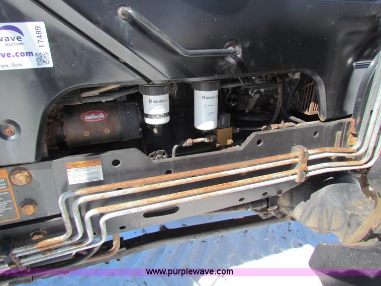 image for item I7489 2006 New Holland TV145 MFWD Bi-directional tractor